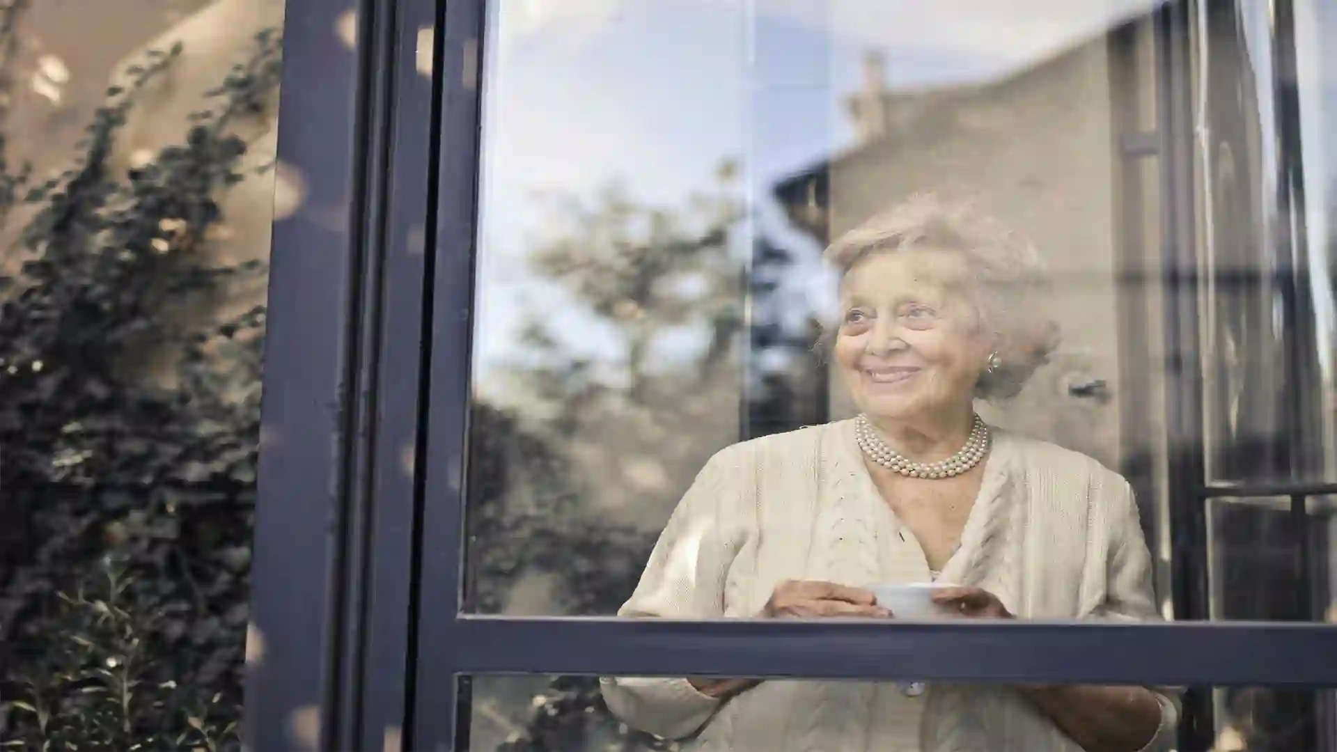 Old women coming out of the car